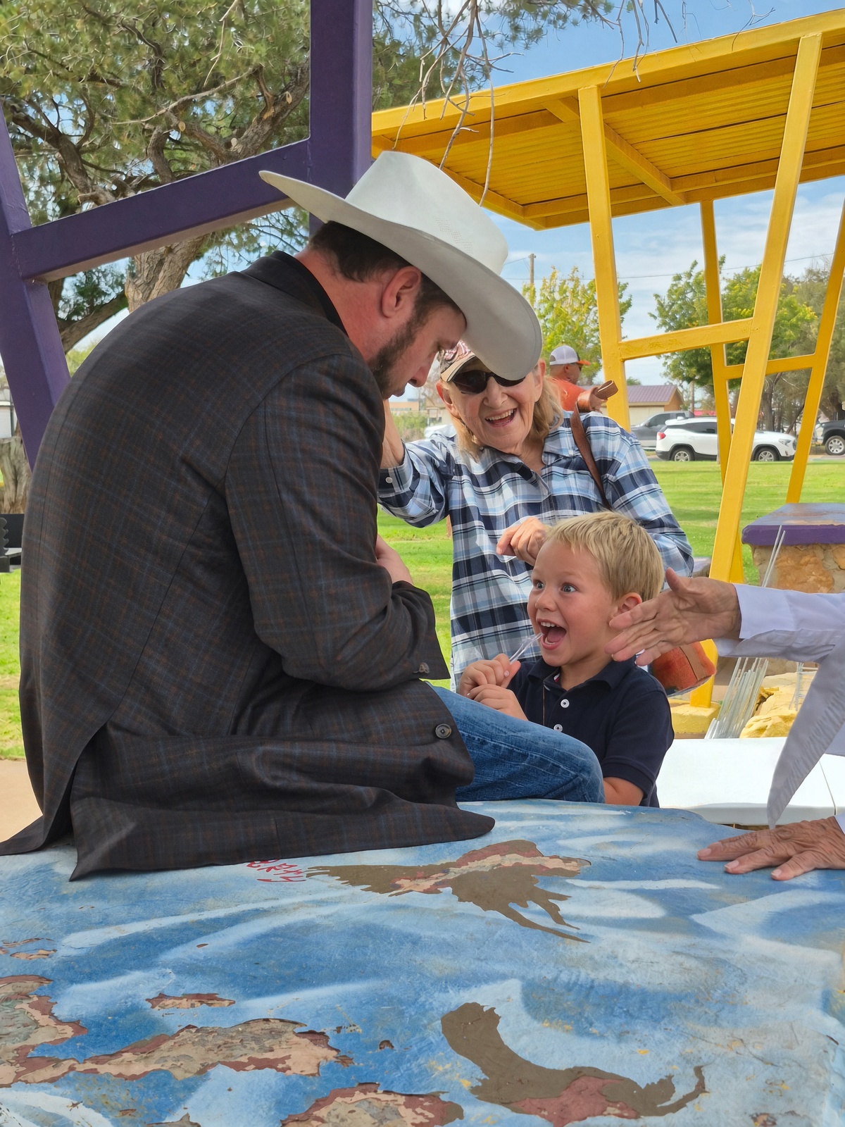 Joshua Lawrence at a campaign event with the New Mexico flag