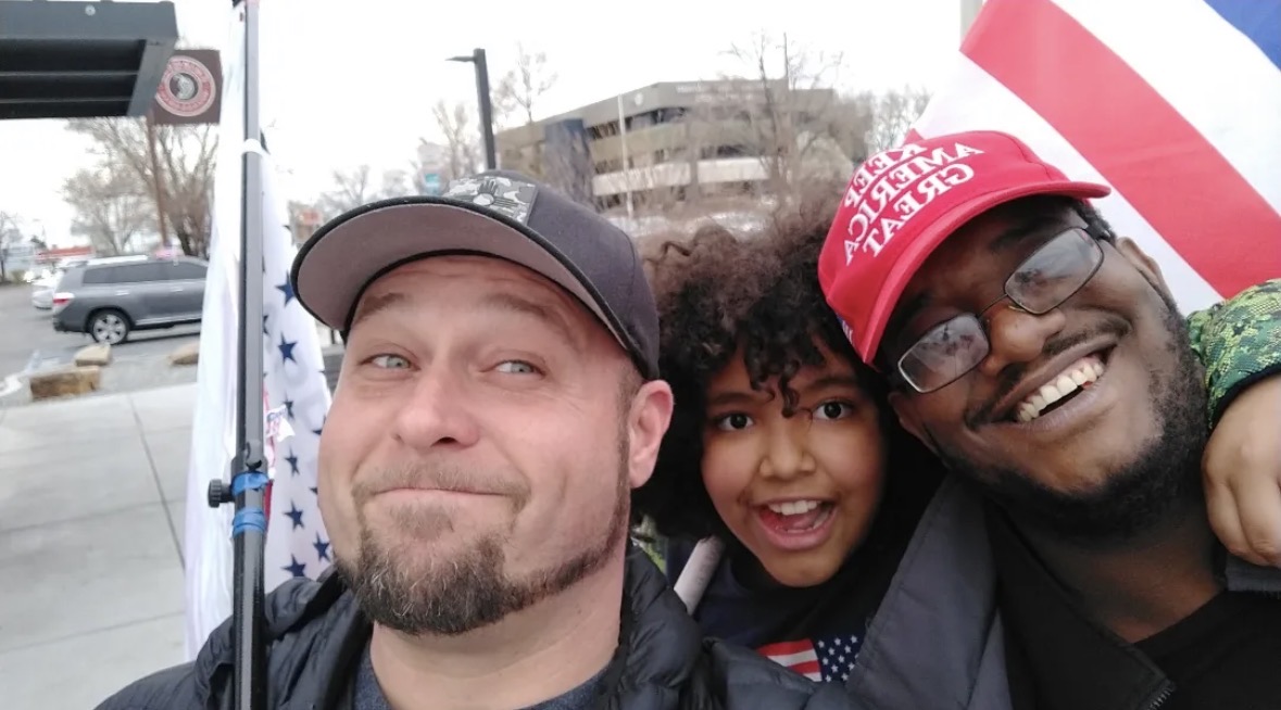 Joshua Lawrence with supporters at a rally